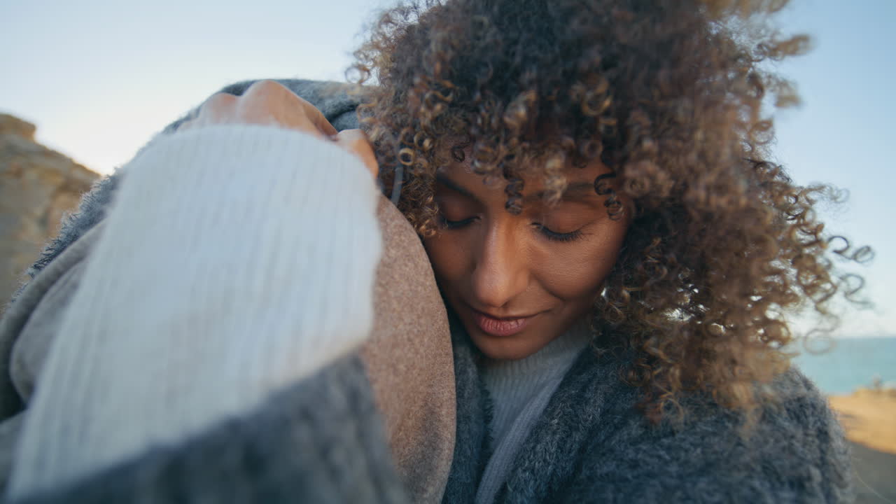 Lovely couple embracing evening beach closeup. Happy woman man lovers cuddling