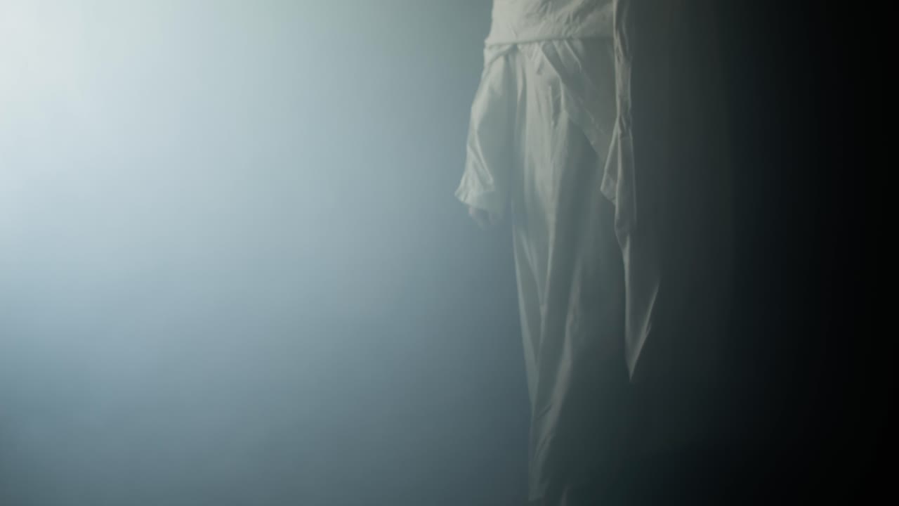 Jesus Christ holding bread, symbolizing salvation, gospel, resurrection in contrasting light and darkness. Perfect for Easter resurrection visual or worship background.