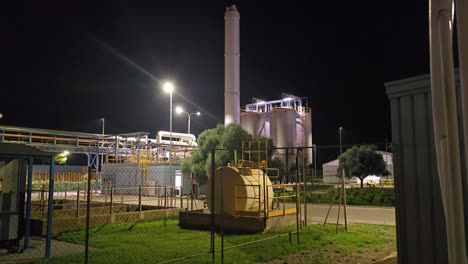 general shot at night in a chemical factory. chimney not work .