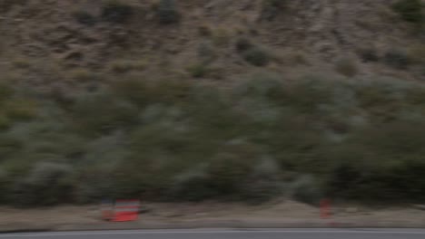 a car travels along pacific coast highway as seen through the side window 2