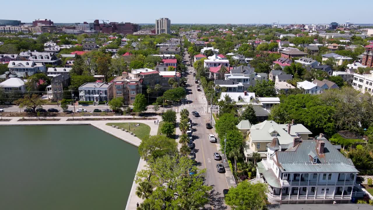 Charleston South Carolina aerial shot of Colonial Lake Park and street dolly forward shot close up