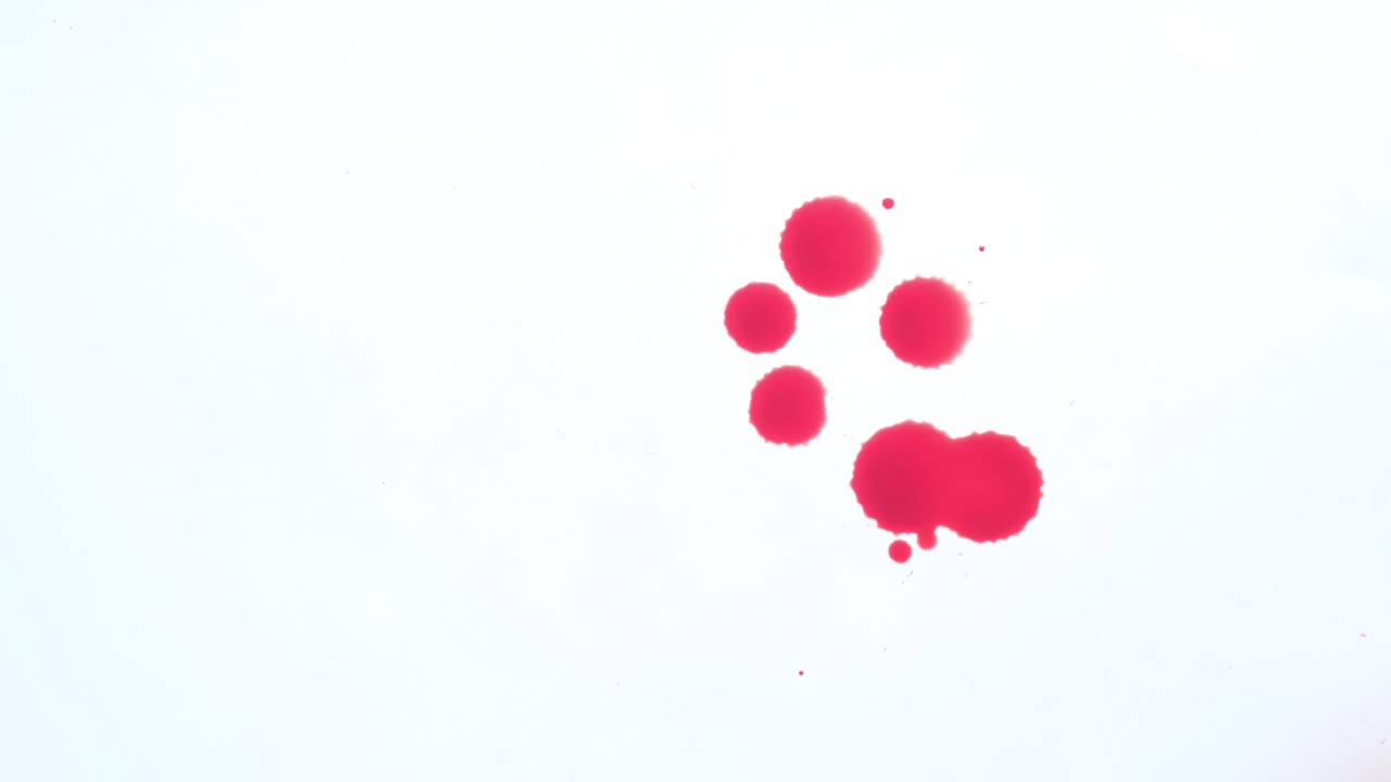Red Ink Stains on White Background