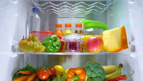 Open-refrigerator-filled-with-food