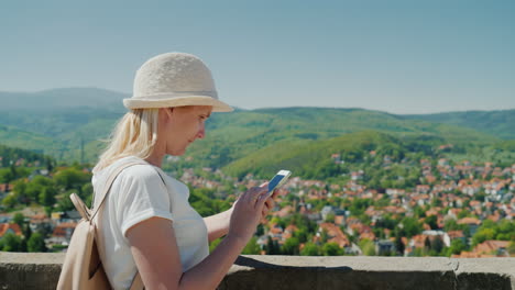 tourist with a smartphone in german countryside