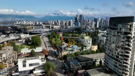 Aerial-Ascend-Over-South-Granville-Revealing-Granville-Bridge-And-Burrard-Street-Bridge-On-False-Creek-In-Vancouver,-Canada