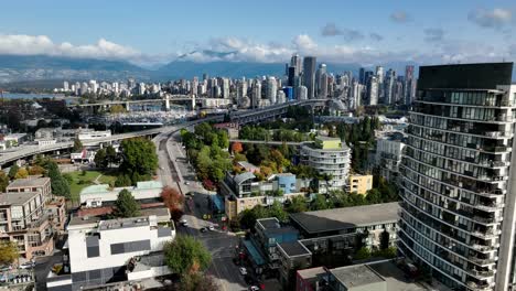 aerial ascend over south granville revealing granville bridge and burrard street bridge on false creek in vancouver, canada