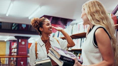 two female students meeting in a library