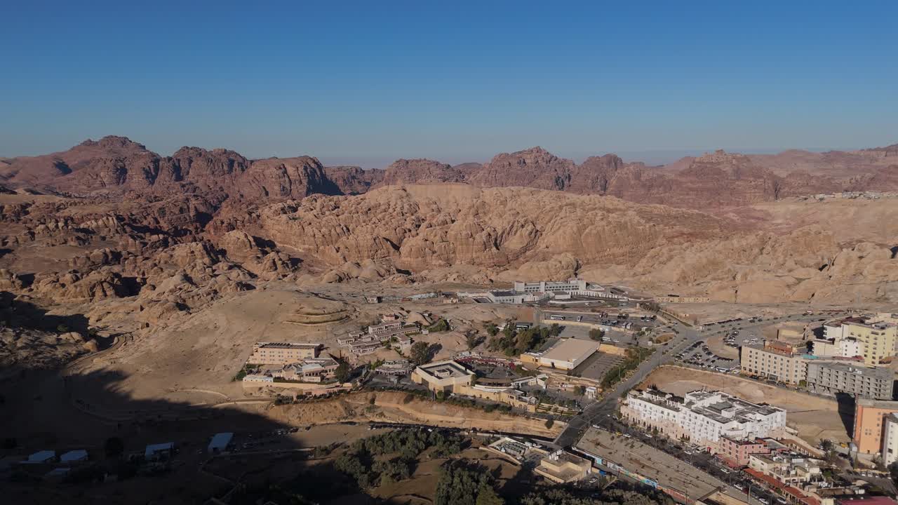 Capturing the urban landscape of modern Jordan, this drone footage reveals the stone architecture and hilly terrain of the town supporting Petra's tourism