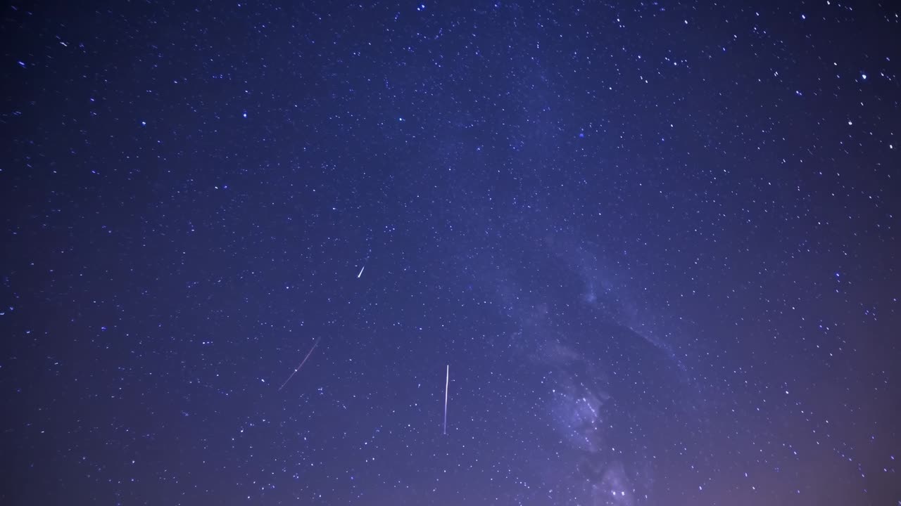 A mesmerizing night sky filled with stars, captured from a low-angle perspective