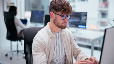 man working at computer in office