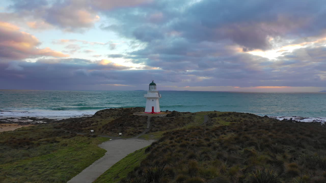 Picturesque aerial view of Waipapa Lighthouse along the coast of New Zealand's South Island