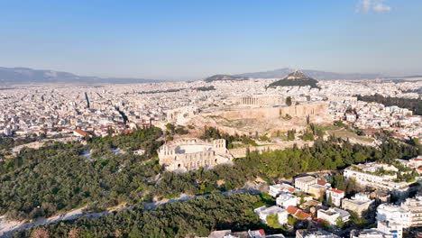 Drone-flight-over-the-Acropolis-and-the-Philoppapos-monument-in-Athens,-Greece