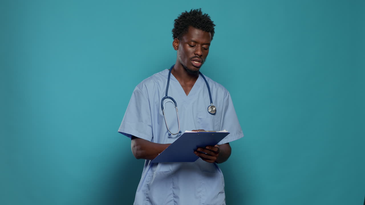 Man working as nurse and writing on medical paper