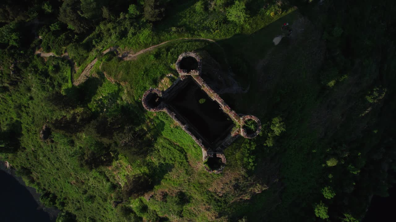 aerial top shot above Alleuze Castle at sunset, Cantal departement, auvergne rhone alpes region, france