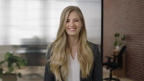 portrait of attractive young blonde woman executive smiling cheerful arms crossed enjoying start up business opportunity confident independent female