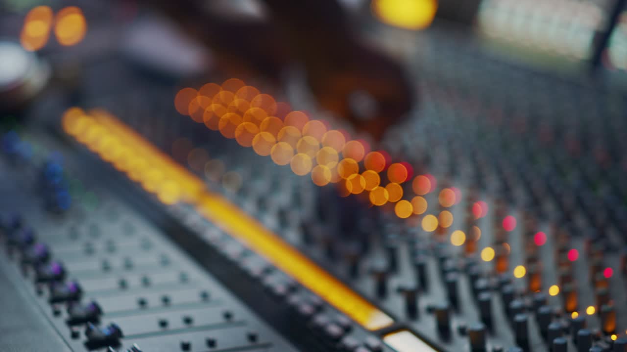 Audio Engineer, Music Creator, Musician, Artist Works in the Music Record Studio, Uses Surface Control Desk EQ Mixer. Buttons, Faders, Sliders to Broadcast, Record, Play Hit Song. Close-up Focus