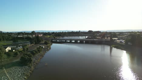 an aerial view of alameda creek in fremont california, framed by greenery and roadways.