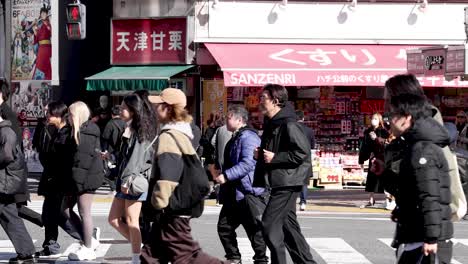 pedestrians crossing a busy urban intersection