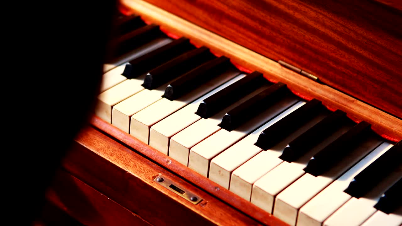 Schoolgirl learning piano in music class 4k