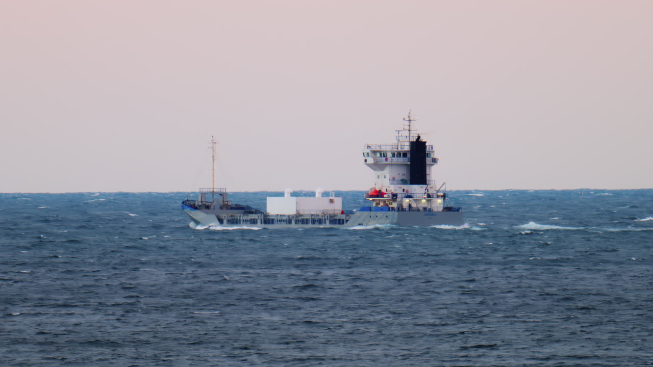 View of a boat moving on the sea in the evening