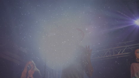bandmates performing on stage, with haze and spotlights  and  floating music notes for technology