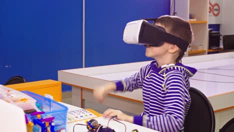 boy wearing vr headset in stem classroom