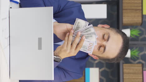 vertical video of the greedy businessman loves their money and kisses it.