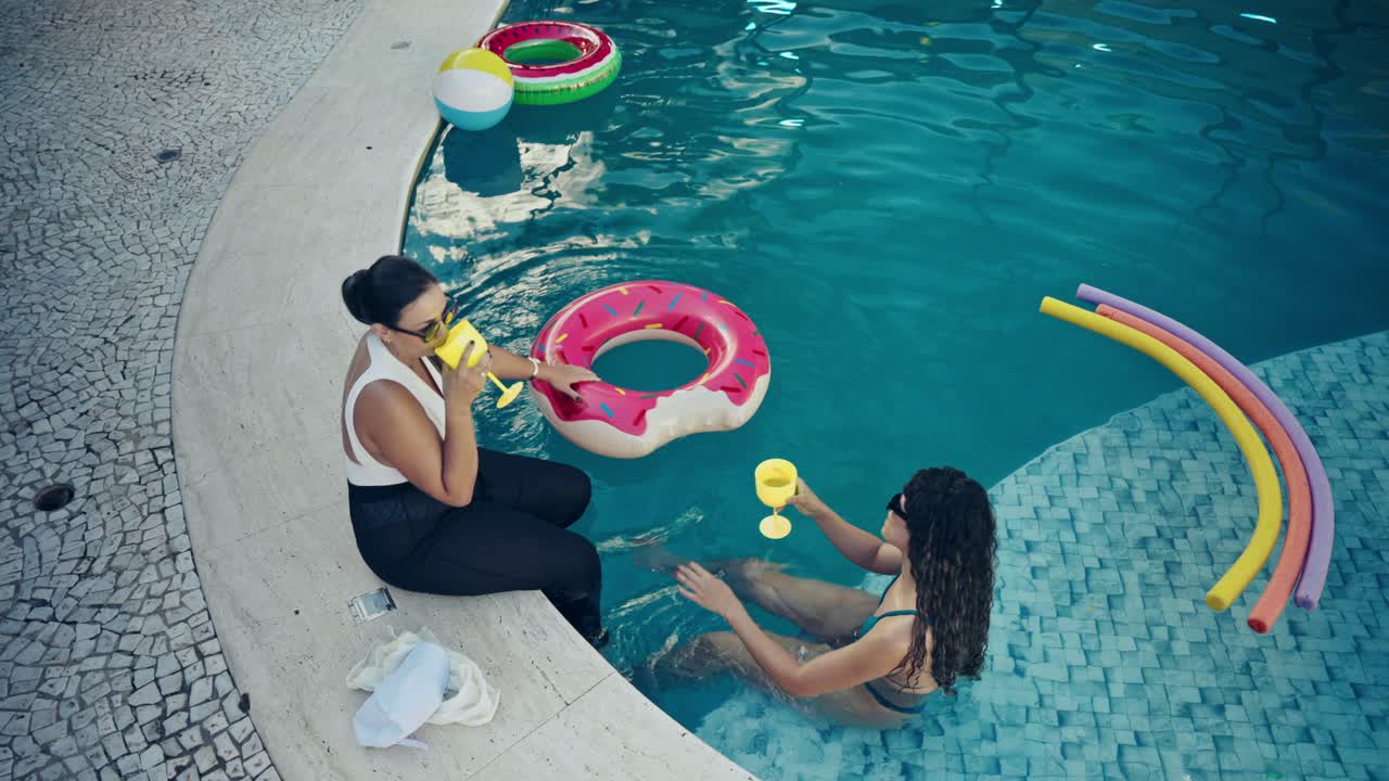 People Enjoying a Pool Party with Food and Drinks