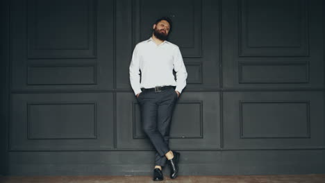 young bearded man. brutal caucasian serious handsome man in studio