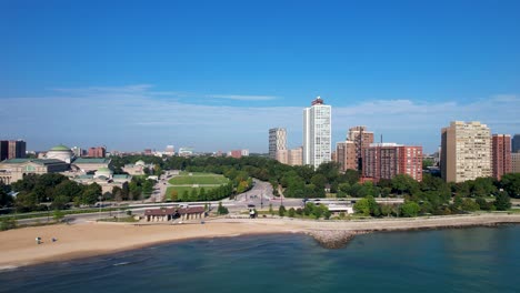 city beach with green trees and apartment buildings