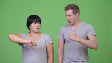 young multi-ethnic couple having different decisions together