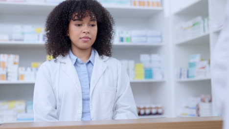 friendly pharmacists giving prescribed medicine to