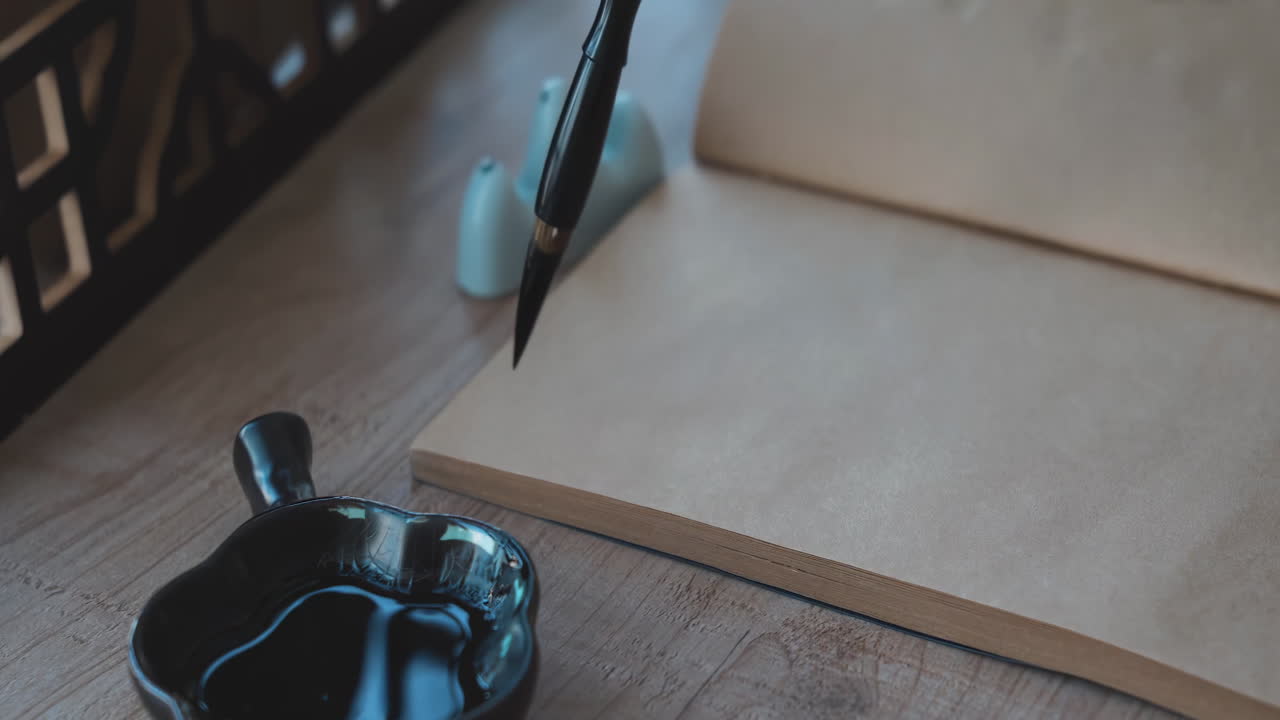 Artistic hand writing inspiration through traditional oriental calligraphy with brush and ink, cultural art practice in a peaceful home setting