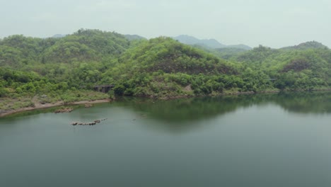 green mountain with river water reflection at morning from flat angle