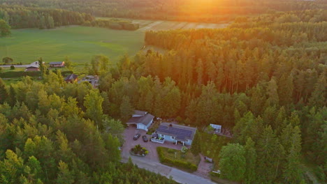 aerial overview a sun powered house, vivid summer morning with solar flares