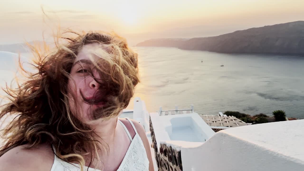Santorini Sunset Selfie with Hair Blowing in the Wind