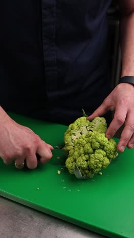 chef preparing green cauliflower