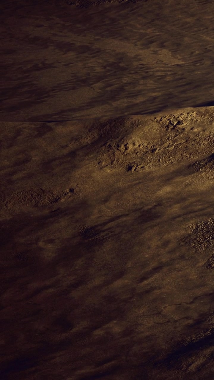 Vast desert landscape under the warm glow of the setting sun