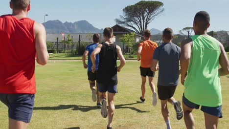 men running outside on sunny day