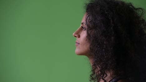 profile view of young beautiful hispanic woman ready for gym