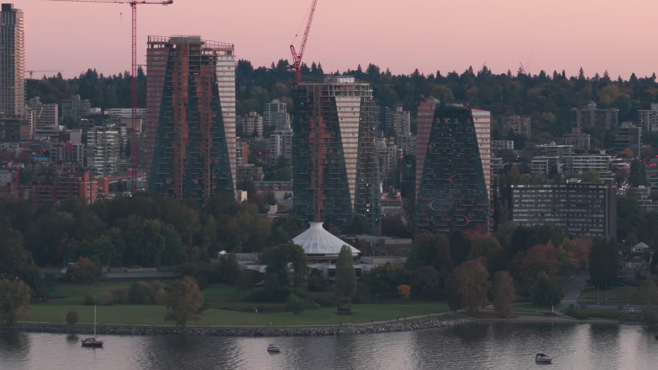 Aerial telephoto panning shot of Vanier Park at sunset in Vancouver, British Columbia, Canada. 4K