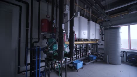 modern industrial gas boiler room equipped for heating process. heating gas boilers, pipelines, valves.