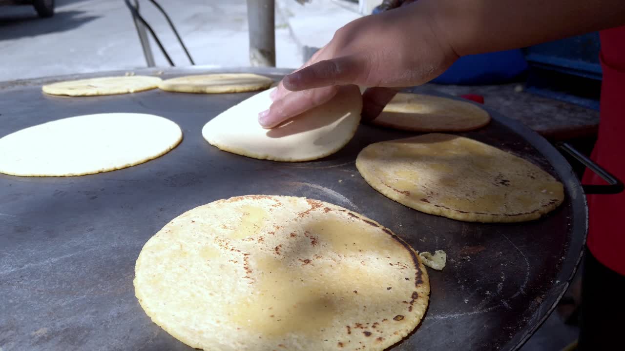 Tortillas Being Cooked On A Flat Griddle. - closeup shot
