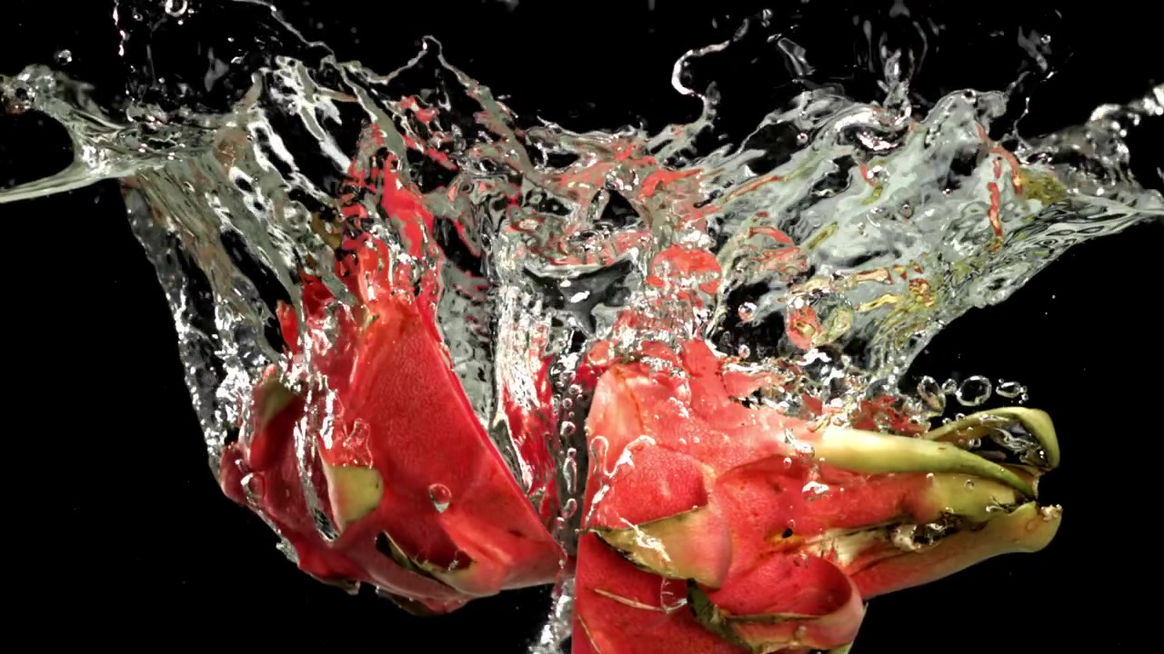 Fresh Dragon Fruit Splashing into Water in Slow Motion
