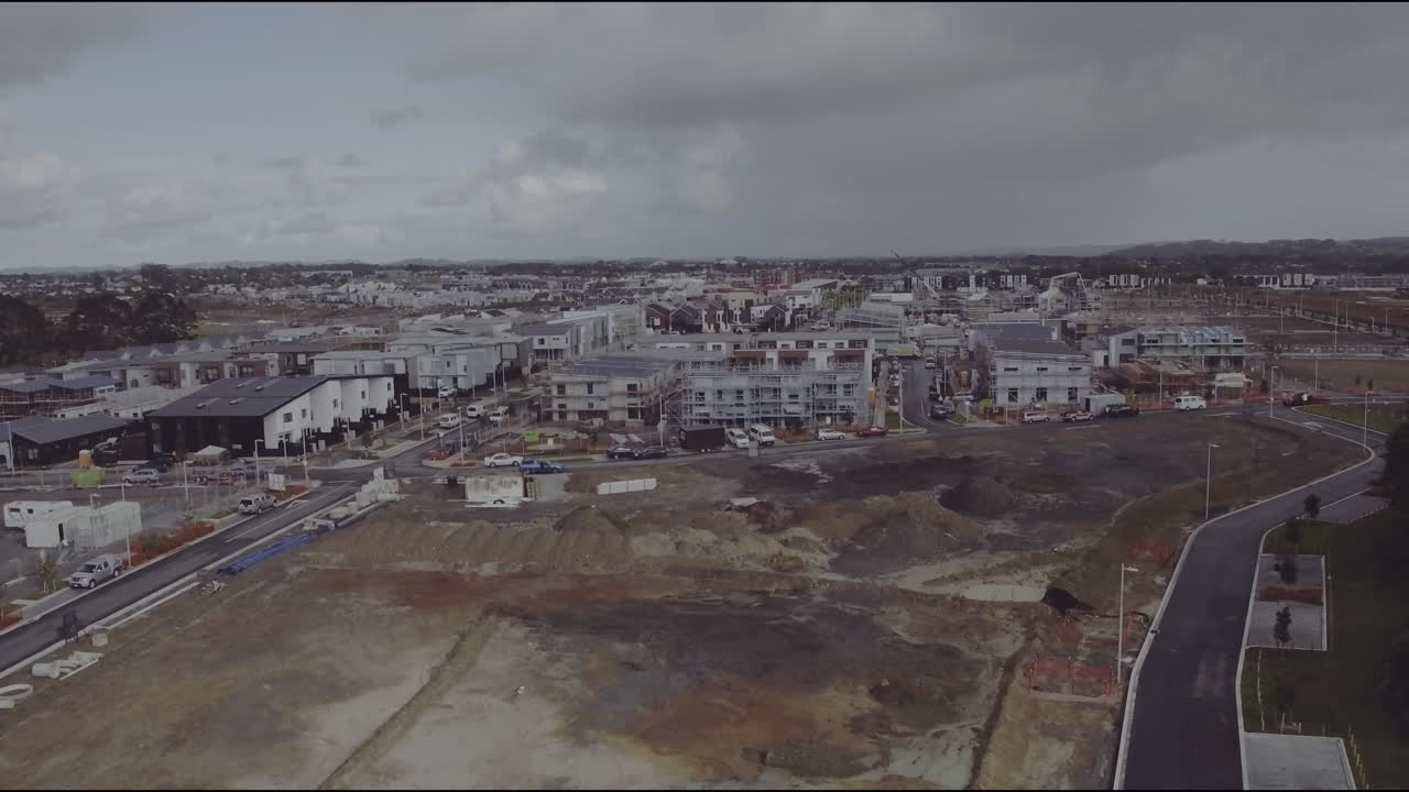 Aerial drone flying over building site towards Hobsonville Point in Auckland, New Zealand
