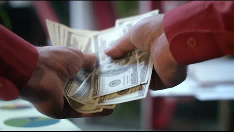 pov view of male hands counting money cash in bank office