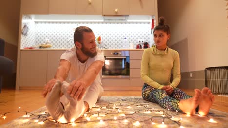 couple stretching at home