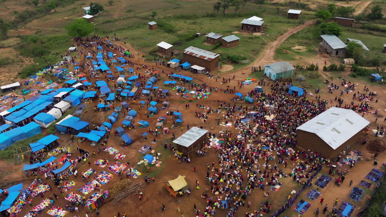 Drone flying over tribal crowd in Kako marketplace