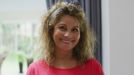 animation of happy biracial senior woman looking at camera