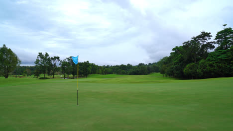 beautiful golf course with mountain hill background